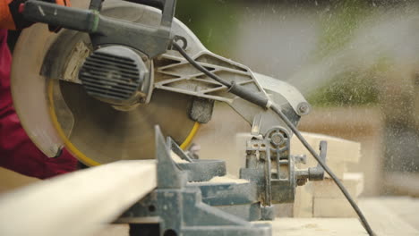 Slow-Motion-Close-Up-of-Table-Saw-Cutting-Wood-on-Construction-Site