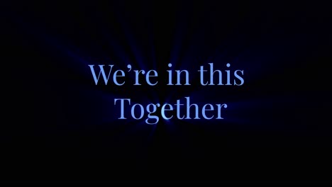"We're-in-this-Together"-slogan-in-animated-text-with-dynamic-lighting-and-black-background-so-you-can-add-any-background-colors