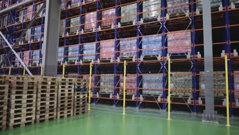 Wide-angle-reveal-shot-of-inventory-on-shelving-inside-warehouse
