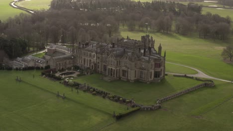 parallax-drone-shot-of-castle-mansion-on-sunny-day