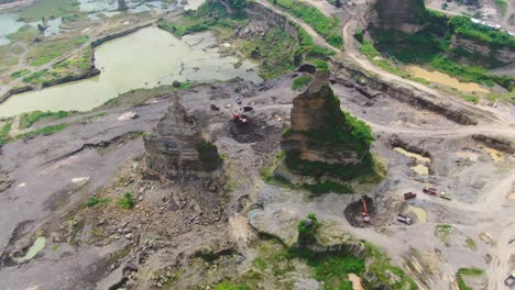 Aerial,-machinery-work-in-opencast-sand-mine-Brown-Canyon-in-Semarang-Indonesia