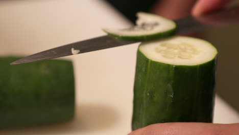 Slicing-Fresh-Cucumber-Vertically-By-A-Sharp-Kitchen-Knife
