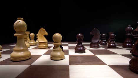 Close-up-of-strategic-chess-moves-on-a-wooden-tournament-chess-board
