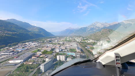 Pilot-viewpoint-from-cockpit,-aircraft-landing-at-mountain-airport-POV