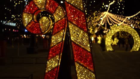 Beautiful-slow-motion-reveal-of-Giant-ornamental-LED-Christmas-"Candy-Cane"-at-Landsdowne-Park,-in-Ottawa,-Canada