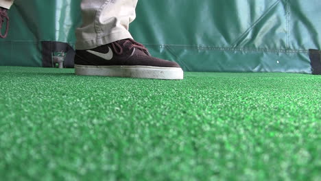Man-in-Brown-Nike-Shoes-Hits-Wedge-Chip-Shots-at-Golf-Driving-Range---02