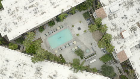 Aerial-shot-of-swimmer-in-apartment-swimming-pool