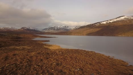 A-mountain-flyover-during-winter-in-Scotland