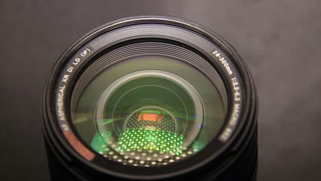 Close-Up-of-DSLR-Camera-Lens-in-the-Dark