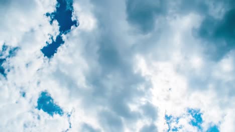 Time-lapse-of-cloudscape-with-bright-sun-shining-and-revealing-itself-behind-clouds