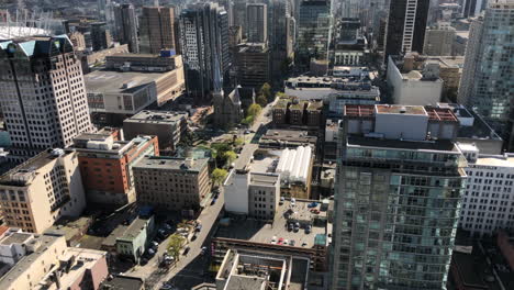 Wide-Aerial-Time-lapse-shot-of-Intersection-in-Vancouver-downtown-on-sunny-day