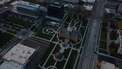 Aerial-view-of-a-beautiful-green-park-with-a-wedding-reception-even-going-on