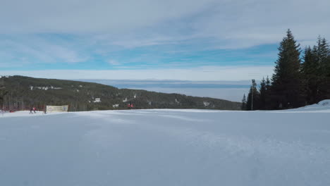 POV-snowboarder-travelling-downhill-on-ski-resort-white-slopes