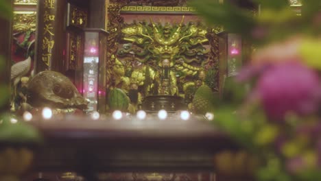 handheld-shot-of-an-altar-in-a-buddhist-temple