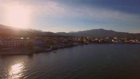 Aerial:-A-small-fishing-village-on-Samos-during-sunset