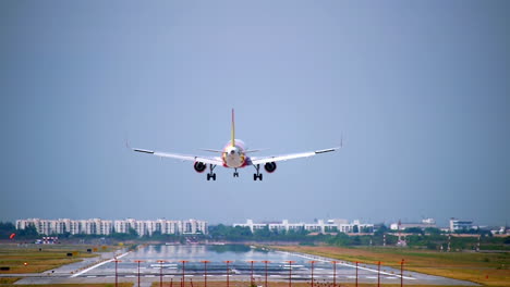 Commercial-aeroplane-or-airliner-on-a-final-approaching-landing-at-an-International-Airport-on-a-clear-morning-sky