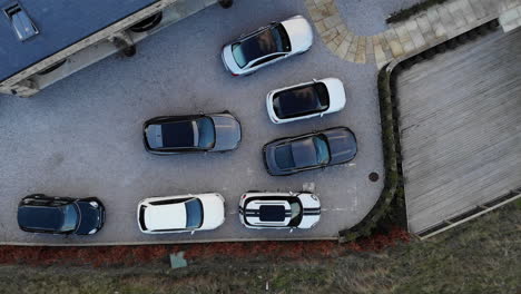 Aerial-Vertical-Top-Down-View-Above-Fancy-Cars-in-Driveway