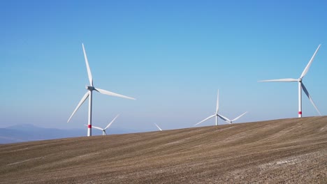 Windmills-in-the-field---slowmo-shot-of-green-electricity-in-Czech-Republic