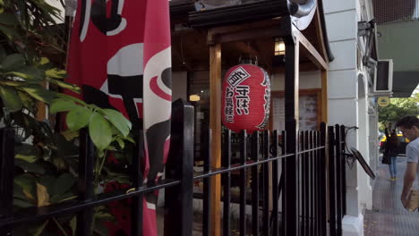 DOLLY-IN-Japanese-red-lantern-on-restaurant-entrance-in-Buenos-Aires-Chinatown