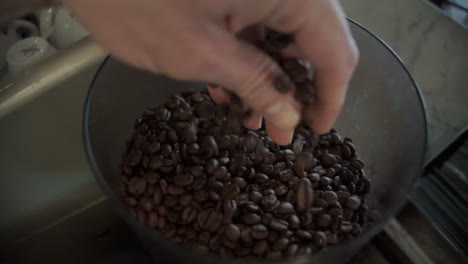 Close-Up-Of-Hand-Mixing-Coffee-Beans-SLOW-MOTION