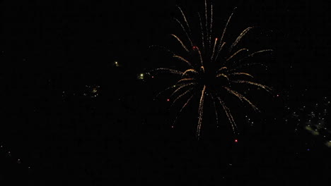 Slow-Motion-Aerial-of-Fireworks-Over-Small-Town