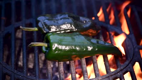 poblano-peppers-on-outdoor-grill-closeup-showing-flames-and-smoke-with-copy-space