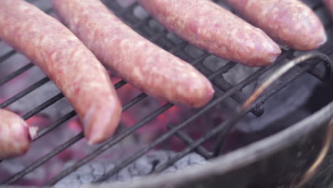 Slow-Motion-Macro-of-Sausages-Grilling-on-Fiery-and-Smokey-BBQ-Grill
