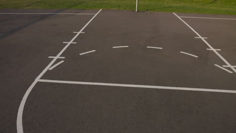 Empty,-park-basketball-court-on-a-beautiful,-summer-morning