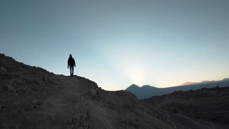 Hiker-silhouette-slow-motion-walking-in-the-desert