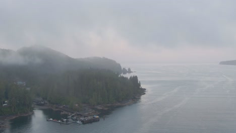 Aerial-View-of-a-small-secluded-town-on-the-Pacific-Ocean-Coast-during-a-cloudy-summer-sunrise