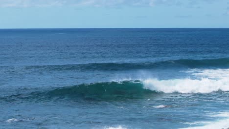 Atlantic-ocean-turquoise-wave-breakers,-Slow-motion-blue-seascape-scene,-sufers-paradise,-Madeira-Islands,-summertime-vibe