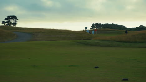 Golfers-and-caddies-walking-at-Bandon-Dunes-Golf-Course-In-Oregon
