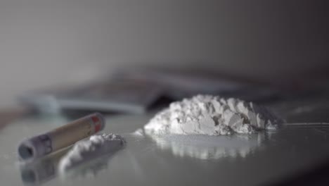 Drugs-and-money-isolated-scene-dramatic-rack-focus-white-powder-and-cash