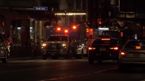 Ambulance-car-with-flashing-lights-at-Park-Avenue-at-Night,-Manhattan,-New-York-City
