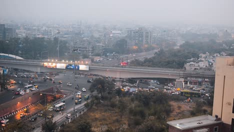 Ariel-view-of-city-traffic-road-vehicles-passing-through-at-evening