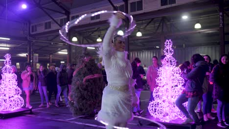 Hula-Hooper-in-Victoria-Night-Market,-during-winter-season,-July,-2019-Queen-Victoria-market-nighttime-during-winter