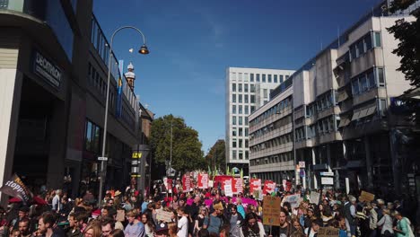 Many-protesters,-from-teenage-"Fridays-for-future"-activists-to-senior-citizens-are-marching-through-the-streets-of-Cologne-demanding-a-reduction-of-fossil-fuels