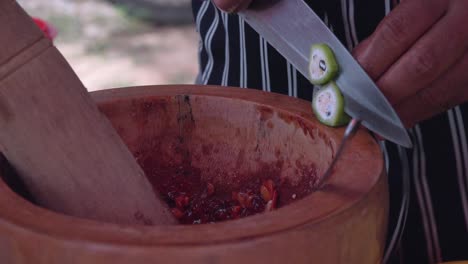 Chopping-Ingredients-into-a-Pestle-and-Mortar