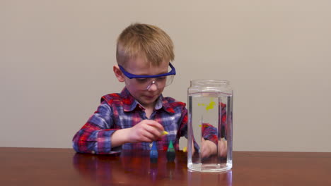 Little-boy-mixing-colors-together-for-a-science-experiment