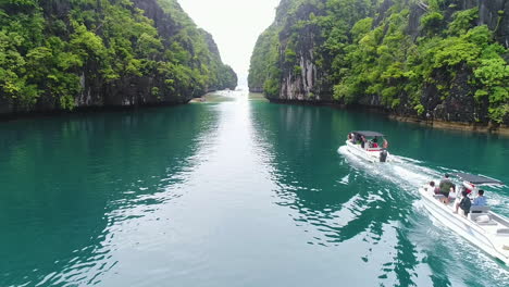 Drone-Shot-Of-Speed-Boats-Cruising-In-A-Blue-Lagoon-In-Palawan-Philippines