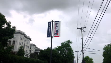 Smooth-tracking-shot-of-a-2020-Presidential-Debate-banner-displayed-outside-Belmont-University-in-Nashville,-TN