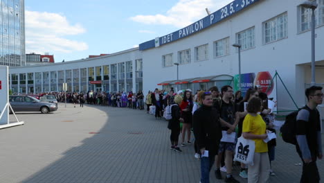 The-main-entrance-to-the-center-and-the-queue-of-people-waiting-before-the-event-of-the-anime-and-Japanese-manga-fans-gathering-at-the-Animefest-event-in-Brno-at-the-exhibition-in-120fps