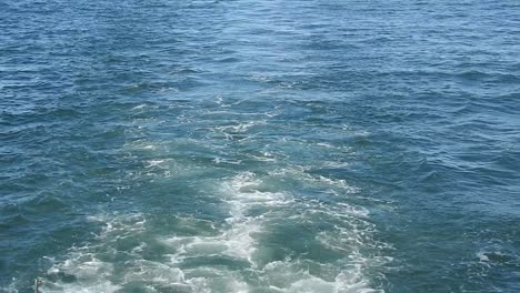 Blue-sea-water-with-boat-trace