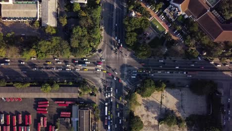 Busy-Bangkok-intersection-traffic-flow,-aerial-time-lapse,-zoom-in