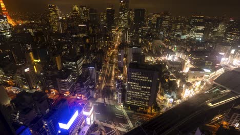 Tokyo-city-view-time-lapse-at-night-time,-lights-of-cars-and-trains-moving-around-the-big-city