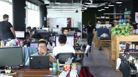 Office-workers-at-a-startup-company-are-busy-working-on-computers