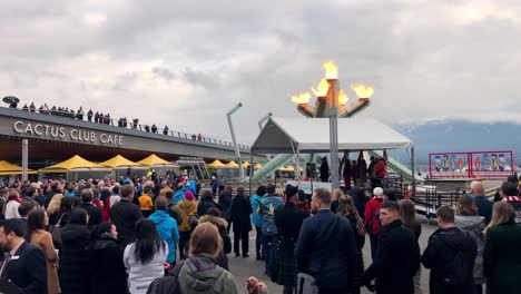 Crowd-of-people-gathering-in-Vancouver-BC-Canada-by-the-waterfront-for-Olympic-anniversary-celebrations-in-march-2020