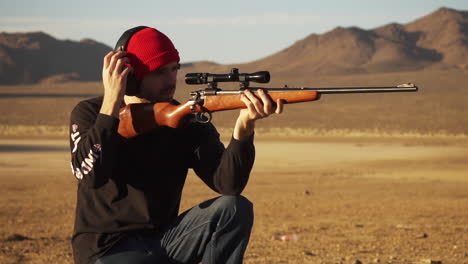 Aiming-a-sniper-rifle-at-Lucerne-Valley-California-in-slow-motion