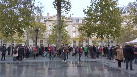Shot-of-People-Gathering-On-Place-De-La-Republique-in-Honor-of-Samuel-Paty,-The-Teacher-killed-by-a-Terrorist,-Paris-France