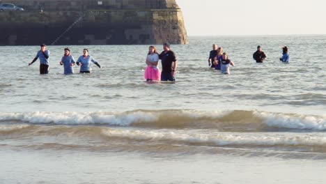 People-in-fancy-dress-returning-from-a-cold-swim-for-Scarborough's-annual-new-years-day-sea-swim